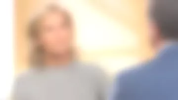 The gray sweater v-neck mesh beaded yellow stripes of Claire Chazal in Passage of the Arts