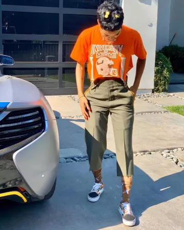 Teyana Taylor's Revenge X Storm Low Top Orange and Green Sneakers en la cuenta de Instagram de @teyanataylor