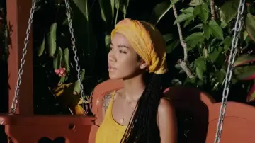 Yellow hair wrap of Jhené Aiko in Jhené Aiko - None Of Your Concern (Official Video)