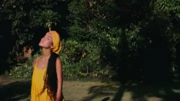 Yellow maxi dress of Jhené Aiko in Jhené Aiko - None Of Your Concern (Official Video)