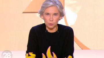 Le pull noir flammes jaune de Élisabeth Quin dans 28 minutes le 19.11.2019