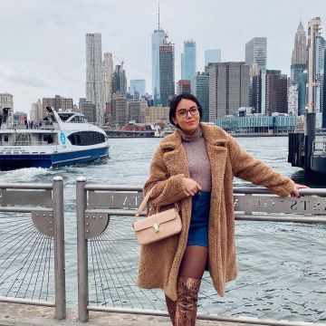 The long coat imitation sheepskin brown worn by Agathe Auprou in New York on his account Instagram