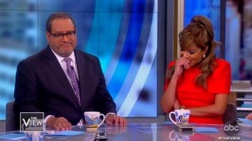 Givenchy Red Cape Ef­fect Wool Crepe Dress worn by Sunny Hostin on The View December 4, 2019