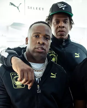 Paper Plane Black The Orig­i­nal Crown 9Fifty Snap­back worn by Jay-Z on the Instagram account @yogotti