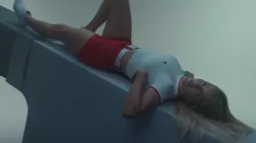 White t-shirt with red sleeves details worn by Ellie Goulding in her Hate Me music video Juice WRLD