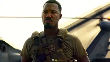 Brown tactical military vest of Five (Corey Hawkins) in 6 Underground