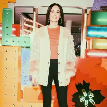 Stella Mccartney Patch­work Over­sized Cardi­gan worn by Kacey Musgraves Stella McCartney’s Holiday Stellabration December 9, 2019