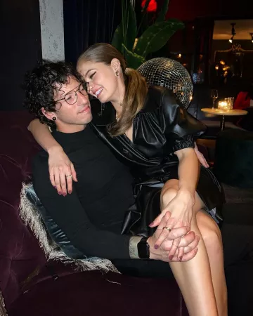 Swarovski Gold-Tone Feath­er Ear­rings of Debby Ryan on the Instagram account @debbyryan December 10, 2019