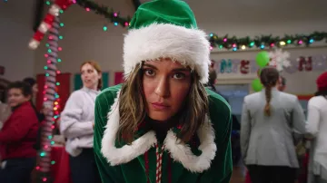The green jacket pixie Lizzie Hinnel (Odette Annable) in the white Nights of Christmas