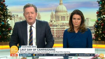 Lk Bennett Blue Jacquard Twist Mi­di Dress worn by Susanna Reid on Good Morning Britain December 11, 2019