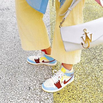 The pair of Nike Jordan 1 Mid IS Fearless Home Chateau Red on the account Instagram of @selmakacisebbagh