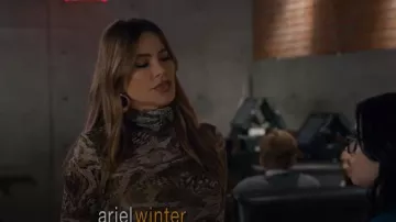 Ganni Brown Marble Print Mesh Turtleneck Top worn by Gloria Delgado-Pritchett (Sofía Vergara) in Modern Family Season 11 Episode 9