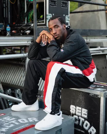The white shoes worn by CJ Fly on the account Instagram of @flyestintheeera