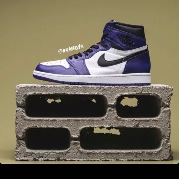 Jordan 1 Mid Obsidian Sanded Purple sur le compte Instagram de @emerald_city_deadstock