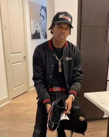 Amiri Em­broi­dered Black Truck­er Hat of Lil Baby on the Instagram account @lilbaby_1