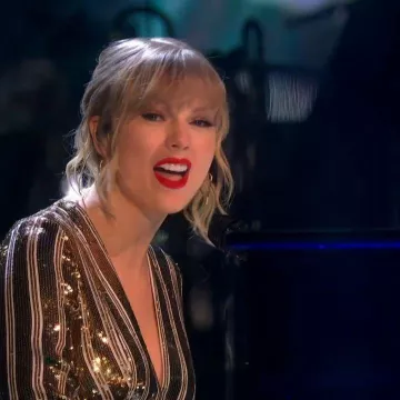 Galvan Plunge-Neck Gold Se­quinned Gown of Taylor Swift on the Instagram account @taylorswift December 14, 2019