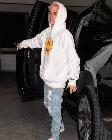 Drew Maison Smiley Face Hoodie, portés par Justin Bieber à Miami le 26 novembre 2019