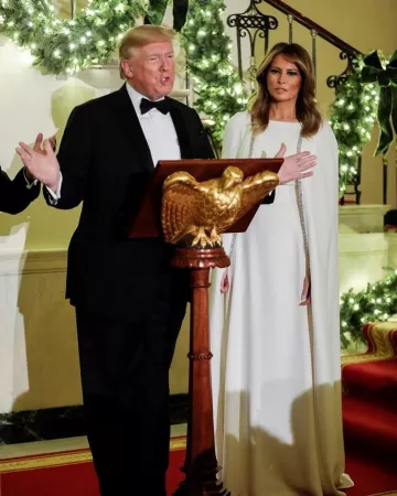 Reem Acra Crys­tal Em­bell­ished Cape Ef­fect Silk Crepe Gown worn by Melania Trump White House Congressional Ball December 12, 2019