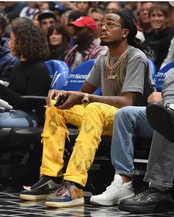 Les sneakers nike brunes air force 1 de Quavo sur le compte Instagram de @quavohuncho