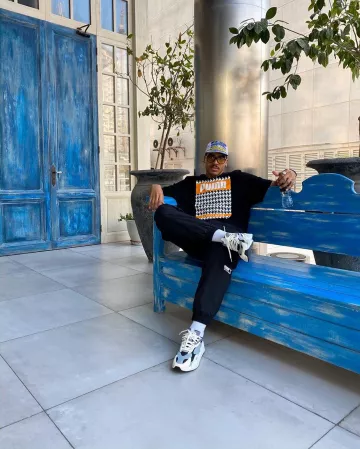 Camiseta puma negra con tablero de ajedrez y gran estampado de logotipo que lleva ruddy ttrobrillant en la cuenta de Instagram de @asos_ruddy