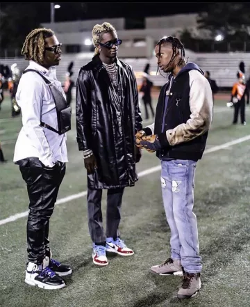 The sneakers green and brown worn by Travis Scott on the account Instagram of @youngthug