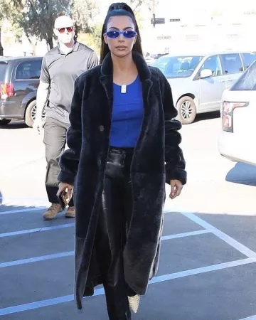 Yeezy Faux Snake Ef­fect Boots worn by Kim Kardashian Los Angeles December 13, 2019