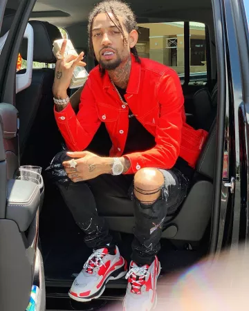 Ba­len­ciaga Triple S (Ver­mil­lon) de PnB Rock sur le compte Instagram de @pnbrock