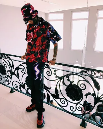 Prada Bas­kets Cloud­bust Thun­der (rouge) de PnB Rock sur le compte Instagram de @pnbrock