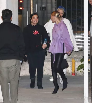 Nanushka Belt­ed Wool And Silk-Blend Jack­et worn by Hailey Bieber Going to Church December 18, 2019