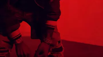 Amiri Blue distressed skinny jeans worn by YFN Lucci in his 7.62 Official Music Video