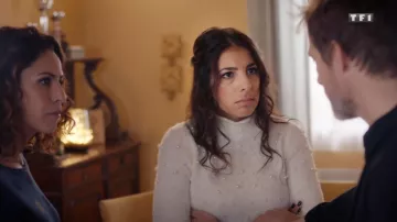 The sweater, with white beads in Tomorrow belongs to us