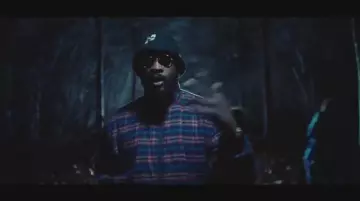 The jacket plaid Balenciaga worn by Damso in the clip God Bless of Hamza