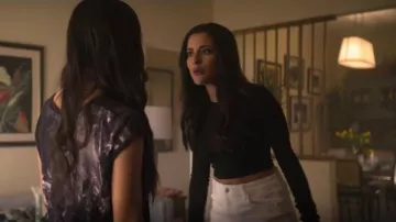 White denim mini skirt worn by Delilah Alves (Carmela Zumbado) in YOU Season 2 Episode 5