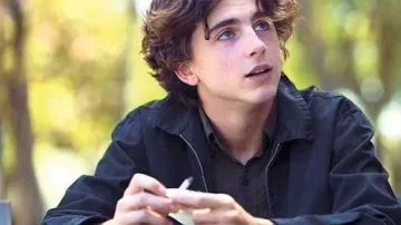 Navy collared jacket worn by Kyle Scheible (Timothée Chalamet) as seen in Lady Bird