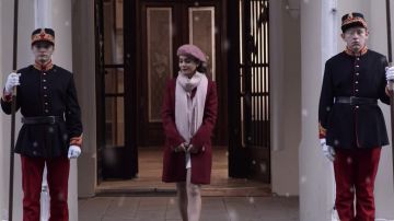 The red coat worn by Stacy De Novo / Lady Margaret (Vanessa Hudgens) in the movie The Princess of Chicago