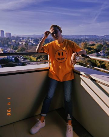 Yellow Drew House T-Shirt worn by Millie Bobby Brown on the Instagram account @milliebobbybrown