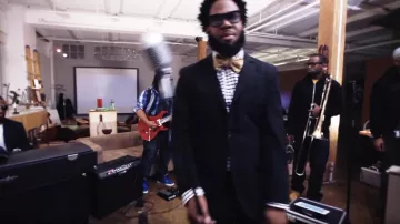 Bow tie yellow Dwele in SWANK. from the 'Greater Than One' album