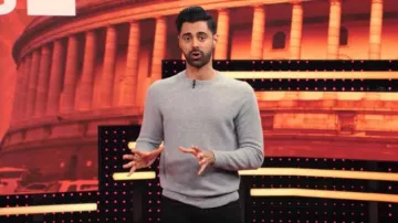 Grey sweater of Himself - Host (Hasan Minhaj) in Patriot Act with Hasan Minhaj (S02E06)