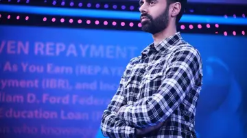Black and white plaid shirt of Himself - Host (Hasan Minhaj) in Patriot Act with Hasan Minhaj (S02E03)