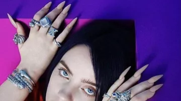 X iced ring worn by Billie Eilish in Billie Eilish - Funny Moments
