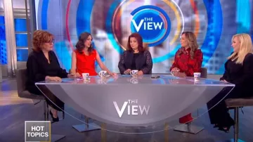 Gucci Ruf­fled print­ed silk-twill shirt worn by Sunny Hostin on The View January 17, 2019