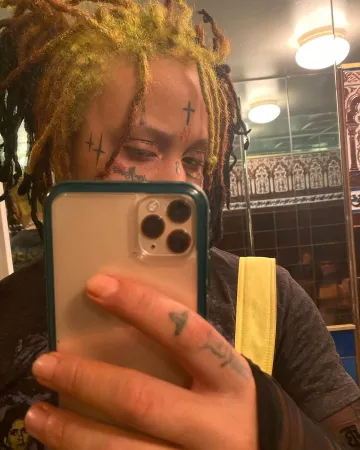 Burberry Black Lo­go Sheer Ly­cra Top of Trippie Redd on the Instagram account @trippieredd