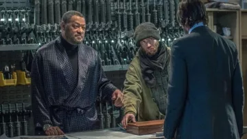 Blue gown dotted with white spots worn by Bowery King (Laurence Fishburne) as seen in John Wick: Chapter 3 - Parabellum