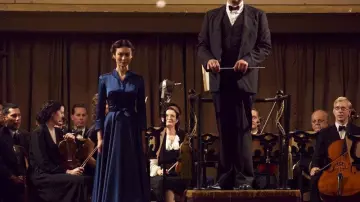 Dress shirt in blue satin worn by Maria Veniaminovna Yudina (Olga Kurylenko) in to The Death of Stalin