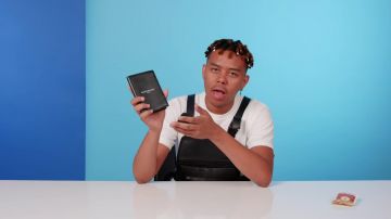 Givenchy Paris Passport Holder worn by YBN Cordae in 10 Things YBN Cordae Can't Live Without | GQ