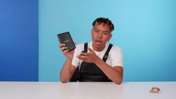Givenchy Paris Passport Holder worn by YBN Cordae in 10 Things YBN Cordae Can't Live Without | GQ