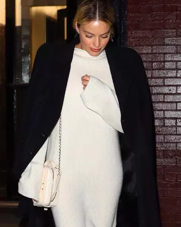 The Row Moa Ribbed Wool And Cashmere Blend Turtleneck Midi Dress worn by Margot Robbie New York City February 3, 2020