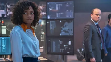 White Satin Shirt with orange collar worn by Eve Moneypenny (Naomie Harris) as seen in No Time to Die