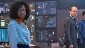 White Satin Shirt with orange collar worn by Eve Moneypenny (Naomie Harris) as seen in No Time to Die