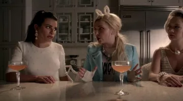 The preppy white crop top worn by Lea Michele (Hester Ulrich) in the series Scream Queens (Season 1 Episode 7)